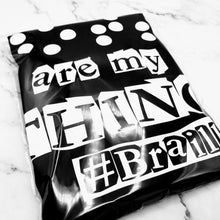 Load image into Gallery viewer, The Dots Are My Thing T-Shirt inside the plastic bag.