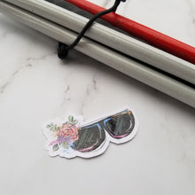 Load image into Gallery viewer, A Eyeglasses Sticker next to a white cane.
