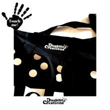 Load image into Gallery viewer, The Hope Tote Bag is open displaying the Disability Creations logo inside near the handles.