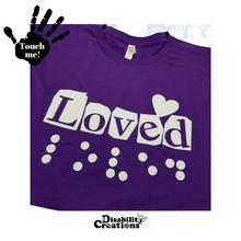 Load image into Gallery viewer, A folded purple shirt with white design. On the top left is a black hand. On the palm, it says, "Touch me." The Disability Creations logo is at the bottom.