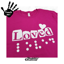 Load image into Gallery viewer, A folded berry shirt with white design. On the top left is a black hand. On the palm, it says, "Touch me." The Disability Creations logo is at the bottom.
