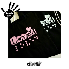 Load image into Gallery viewer, The Loved tote bag and Loved drawstring bag are next to each other.