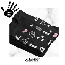 Load image into Gallery viewer, A folded shirt. On the top left is a black hand. On the palm, it says, "Touch me." The Disability Creations logo is at the bottom.