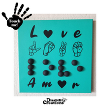 Load image into Gallery viewer, A canvas that says "Love" in four different languages. The first line is "love" in English. The second line has "Love" in American Sign Language - fingerspelling. The third line has "love" in 3D Braille. Finally, the fourth line has love in Spanish.