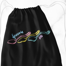 Load image into Gallery viewer, A Black tote bag outline of three engraved vintage spoons (pink, yellow, and turquoise) lined up side to side with the handles on the right. It says, &quot;Spoonie life.&quot; &quot;Spoonie&quot; is located above the first spoon. &quot;Life&quot; is below the third spoon&#39;s handle. ⁠
