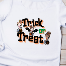 Load image into Gallery viewer, The white shirt Laying on a wood table.