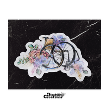Load image into Gallery viewer, A Wheelchair with Flowers Sticker on top of a black marble table.