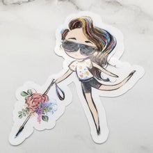 Load image into Gallery viewer, The Blind Woman with a White Cane sticker features the light skin and dyed pink hair option on a white marble table.
