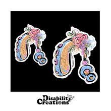 Load image into Gallery viewer, Two Colorful Glittery Hearing Aid with Flowers stickers on a black background.

