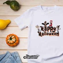 Load image into Gallery viewer, The Happy Halloween shirt next to jeans and small pumpkins.. 
