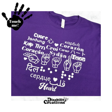 Load image into Gallery viewer, A purple shirt with white design. On the top left is a black hand. On the palm, it says, &quot;Touch me.&quot; The Disability Creations logo is at the bottom.
