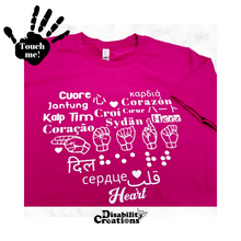 Load image into Gallery viewer, A berry shirt with white design. On the top left is a black hand. On the palm, it says, &quot;Touch me.&quot; The Disability Creations logo is at the bottom.
