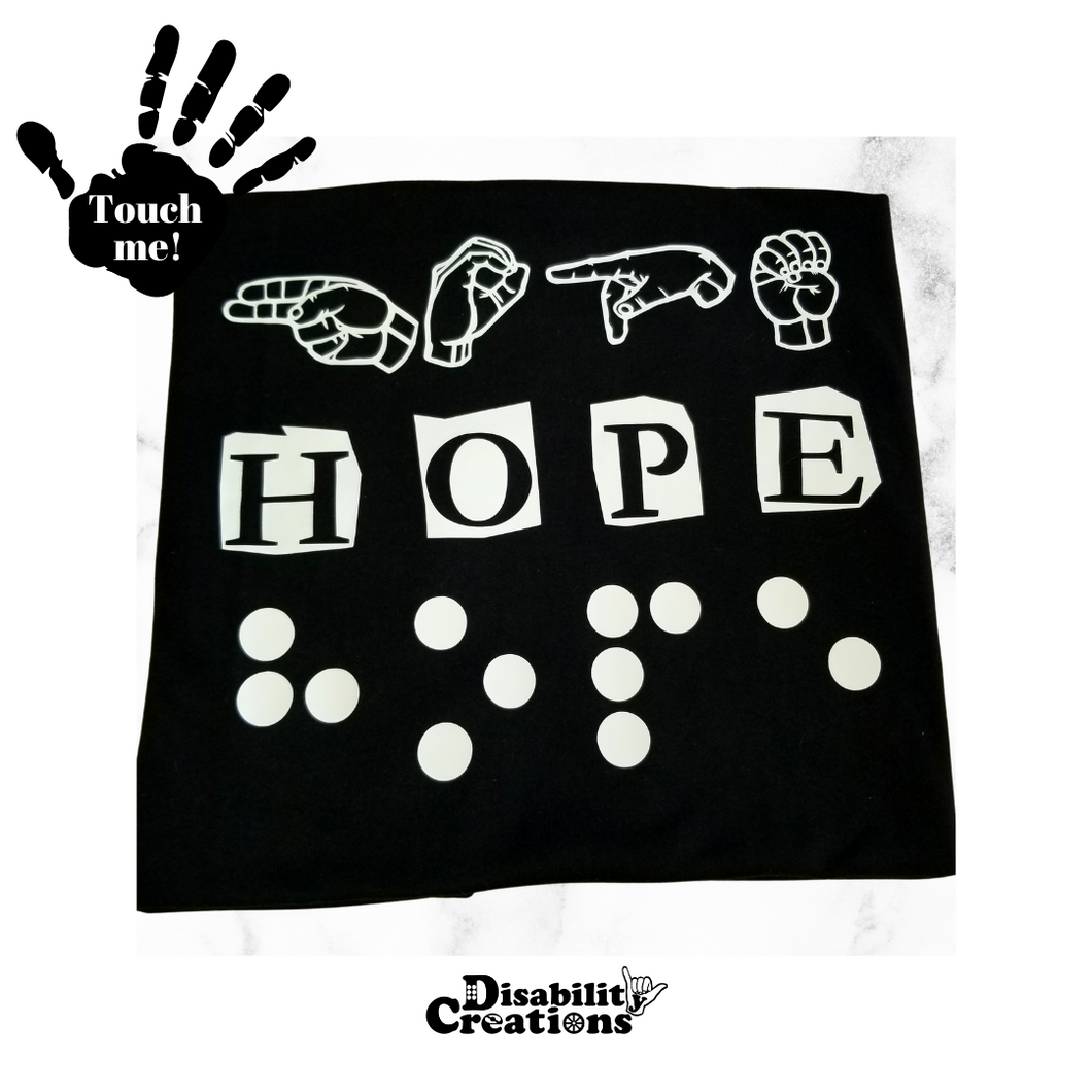 A black t-shirt says 