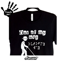 Load image into Gallery viewer, The Out Of My Way (Braille Accessible) T-Shirt on a hanger. A folded shirt. On the top left is a black hand. On the palm, it says, "Touch me." The Disability Creations logo is at the bottom.
