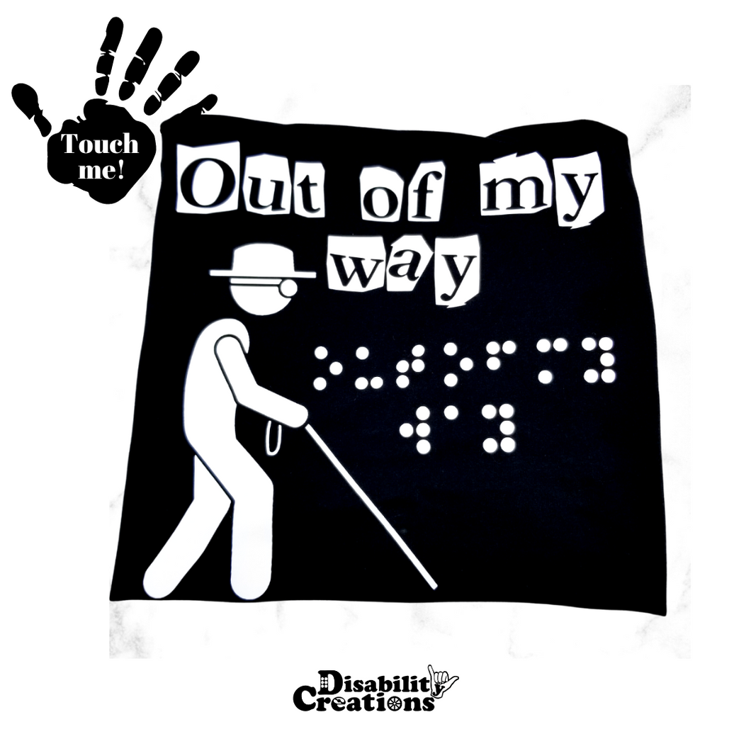 A folded shirt. On the top left is a black hand. On the palm, it says, 