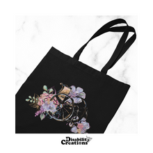 Load image into Gallery viewer, The Wheelchair with Flowers tote bag. 
